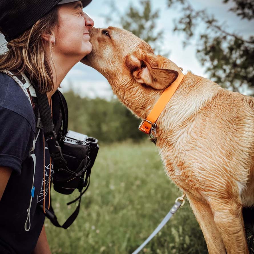 Photographer wearing a camera using a camera strap