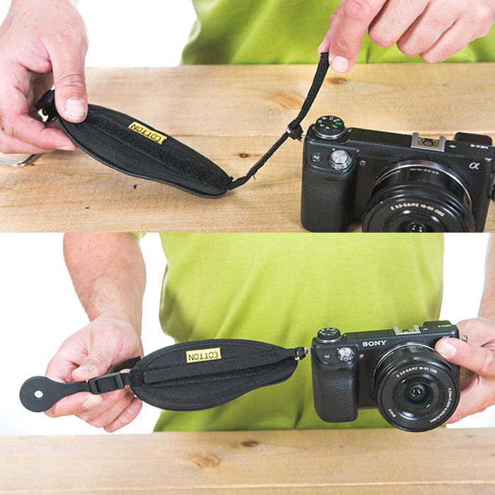 Camera hand strap being attached to a camera